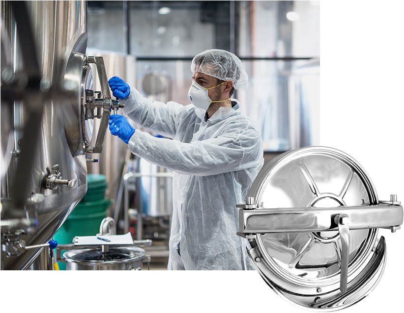 Technologist inspecting stainless steel hygienic processing equipment